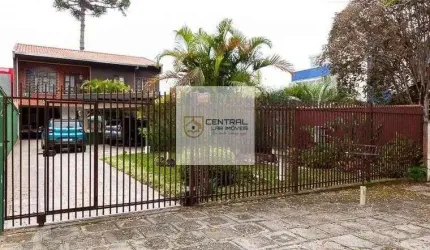 Sobrado  no  Bacacheri, 2 suites, 6 quartos sendo 2 no térreo.