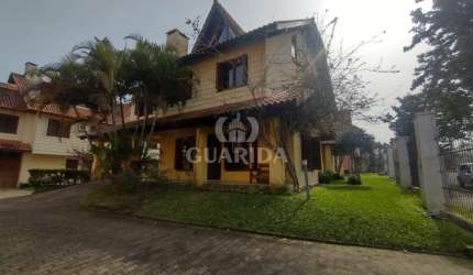 Casa em condomínio fechado com 3 quartos à venda na Rua Luís Felipe Monmany, 101, Espírito Santo, Porto Alegre por R$ 565.000
