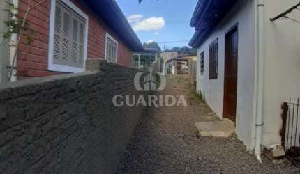 Casa com 2 quartos à venda na Rua Miguel Ascoleze, 186, Vila Nova, Porto Alegre por R$ 305.000