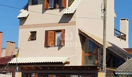 Casa com 3 quartos à venda na Rua Claudio da Silva Pinto, 221, Espírito Santo, Porto Alegre por R$ 900.000