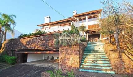 Casa com 4 quartos à venda na Rua Dona Lida Monteiro, 180, Teresópolis, Porto Alegre por R$ 1.890.000