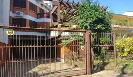 Casa com 4 quartos à venda na Rua Canto e Melo, 64, Nonoai, Porto Alegre por R$ 1.490.000