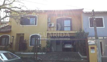 Casa com 3 quartos à venda na Rua André Primo Biazetto, 414, Campo Novo, Porto Alegre por R$ 1.100.000