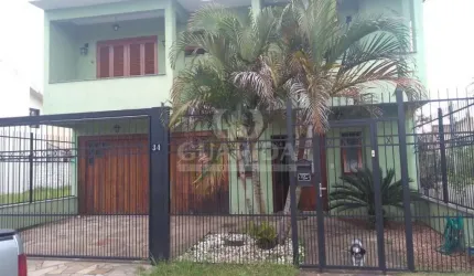 Casa com 3 quartos à venda na Rua Louro, 34, Hípica, Porto Alegre por R$ 745.000