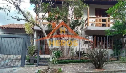 Casa com 3 quartos à venda na Rua Olécio Cavedini, 255, Espírito Santo, Porto Alegre por R$ 1.100.000