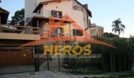 Casa com 4 quartos à venda na Rua Arachanes, 183, Espírito Santo, Porto Alegre por R$ 1.100.000