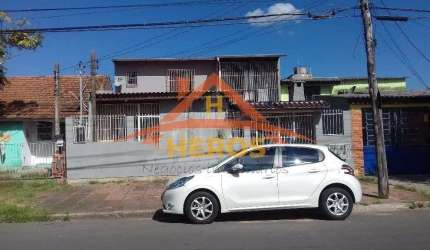 Casa com 3 quartos à venda na Avenida Macedônia, 826, Restinga, Porto Alegre por R$ 330.000