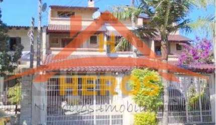 Casa com 3 quartos à venda na Rua Dário Cardoso, 40, Espírito Santo, Porto Alegre por R$ 660.000