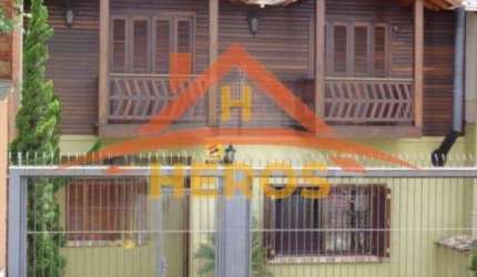 Casa com 5 quartos à venda na Rua Mata Coelho, 98, Nonoai, Porto Alegre por R$ 650.000