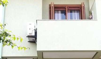 Casa com 3 quartos à venda na Rua Heitor Kramer, 486, Guarujá, Porto Alegre por R$ 449.900