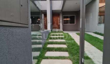 Casa com 3 quartos à venda na Rua Itacyr Rossi, 31, Guarujá, Porto Alegre por R$ 525.000