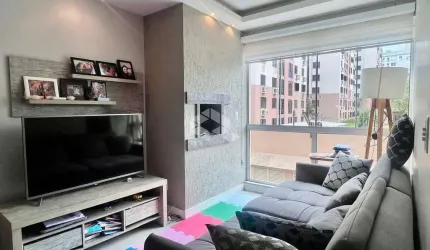 Apartamento com dois quartos, churrasqueira e vaga, no Sarandi