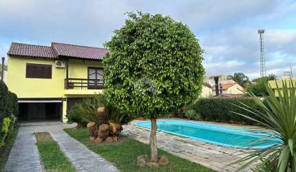 Casa à venda com 3 quartos/dormitórios, 5 vagas/box, no bairro Partenon, Porto Alegre.