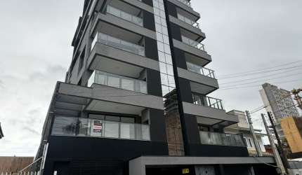 OPORTUNIDADE APARTAMENTO NO CENTRO DE BALNEARIO PIÇARRAS COM TRES QUARTOS SENDO UMA SUITE