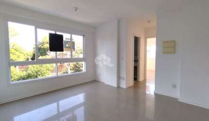 APARTAMENTO NO BAIRRO SÃO SEBASTIÃO, 2 DORMITÓRIOS,  SENDO 1 SUÍTE, 2 BANHEIROS, 1 VAGA