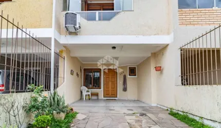 Casa 2 dormitórios com pátio 2 vagas no Bairro Hípica