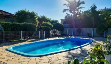 Casa em condomínio fechado semi mobiliada 90m² 02 dormitórios 02 vagas cobertas no Bairro Rio Branco, em Canoas