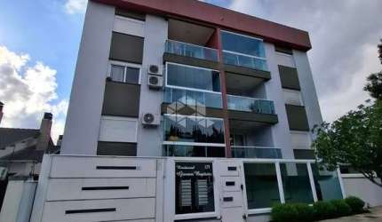 Apartamento semimobiliado, com dois dormitórios,  uma suíte e garagem.