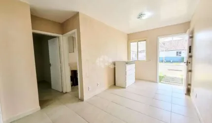 Casa em condomínio fechado, infraestrutura completa, bairro São Luiz, Canoas. 2 dormitórios, semimobiliada, pátio com churrasqueira, 2 vagas cobertas