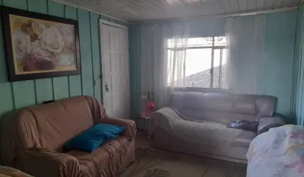 MEIO LOTE COM CASA