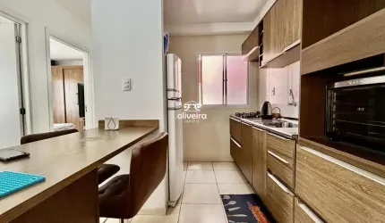 Apartamento com sacada e churrasqueira