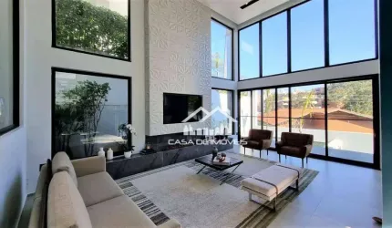 Vende magnífica casa em condomínio com 4 suítes, piscina, academia e muita luz natural no Jardim Vitória Regia.