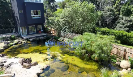 Encantadora Casa Triplex com Lago Artificial à Venda em Nova Guarapari - Um Paraíso Particular a Po