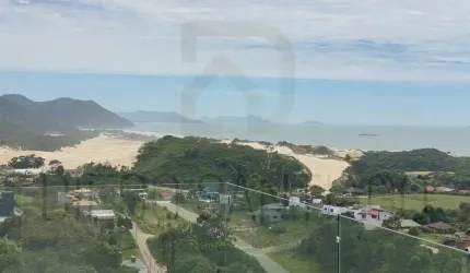 Casa à venda em Garopaba-SC, Areais de Macacu: 3 quartos, 3 suítes, 3 salas, 4 banheiros, 2 vagas, 207m² - Vista deslumbrante de mar e dunas!