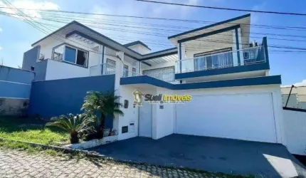 Casa com 4 dormitórios, 302 m² - venda por R$ 1.300.000,00 ou aluguel por R$ 7.200,00/mês - Jardim Guanabara - Macaé/RJ