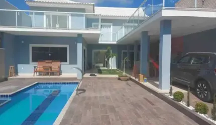 Casa espetacular mobiliada com piscina em Condomínio Fechado com 5 Suítes