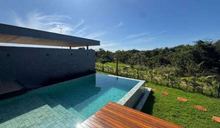 Luxuosa Casa no Florais da Mata a Venda – 4 Suítes, 3 Vagas, Energia Solar e Carregador Veicular e