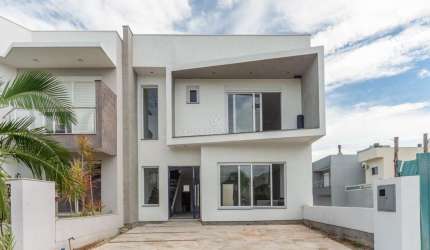Casa em condomínio fechado com 3 quartos à venda na Rua Jorge Babot Miranda, 680, Hípica, Porto Alegre por R$ 1.070.000