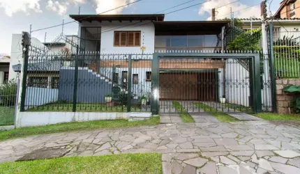 Casa com 3 quartos à venda na Rua Doutor Egydio Michaelsen, 250, Cavalhada, Porto Alegre por R$ 980.000