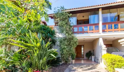 Casa em condomínio fechado com 3 quartos à venda na Avenida Eduardo Prado, 2050, Cavalhada, Porto Alegre por R$ 960.000