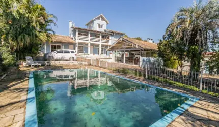 Casa com 6 quartos à venda na Rua Marquês do Maricá, 444, Vila Nova, Porto Alegre por R$ 1.300.000