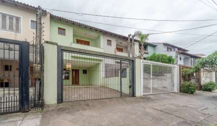 Casa com 3 quartos à venda na Rua Claudio da Silva Pinto, 72, Espírito Santo, Porto Alegre por R$ 695.000
