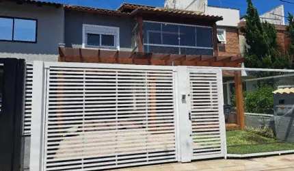 Casa em condomínio fechado com 3 quartos à venda na Rua Aldo Sani, 84, Hípica, Porto Alegre por R$ 790.000