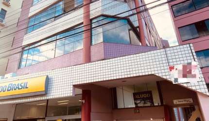 Vendo amplo apartamento com  2 quartos e garagem em cima da agência do Banco do Brasil e em frente a Locomotiva