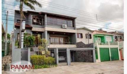 Casa com 5 quartos à venda na Beco Circular, 631, Vila Jardim, Porto Alegre por R$ 1.980.000