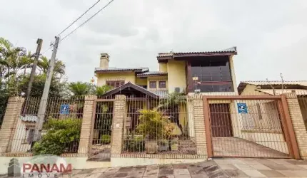 Casa com 4 quartos à venda na Travessa Porto Príncipe, 59, Jardim Lindóia, Porto Alegre por R$ 1.690.000