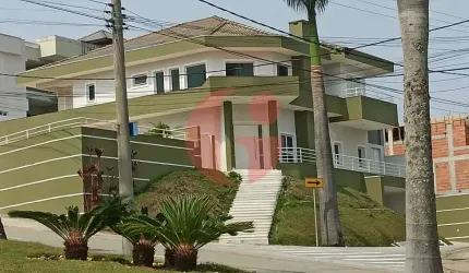 Sobrado em condomínio para venda com 04 quartos (5 suítes) e 08 vagas de garagem - 900m² no Jaguary