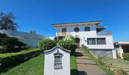 Casa de Alto Padrão Residencial/Comercial localizada no Bairro Ribeirânia, terreno de 1703m² e 862,73m² de área construída, 6 suítes.