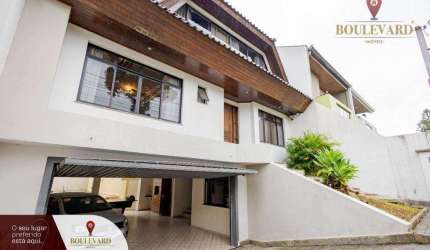 Casa com amplo quintal, piscina e 3 dormitórios à venda, 271 m² por R$ 1.650.000 - Jardim das Américas - Curitiba/PR