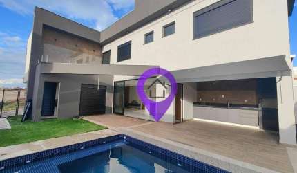 Casa com 4 dormitórios no Condomínio Las Palmas, 228m² construídos. Destaques: suíte máster com hidromassagem, piscina aquecida tecnologia sustentável
