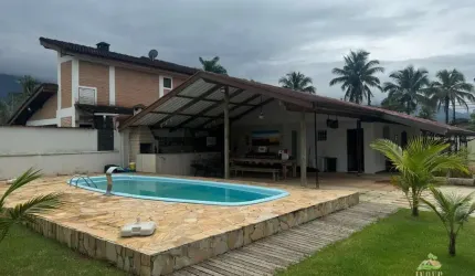 Casa  à Venda em Bertioga/SP - Morada da Praia: 4 Quartos, Piscina, Jacuzzi e Mais!