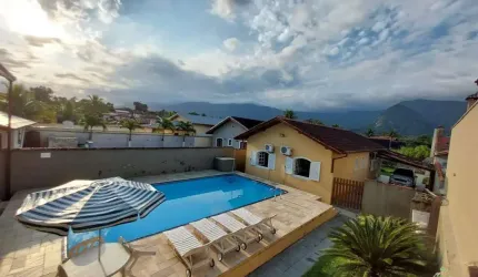 Viva o sonho na praia: casa à venda em Morada da Praia, Bertioga/SP - 3 quartos, piscina, área gourmet e muito mais!