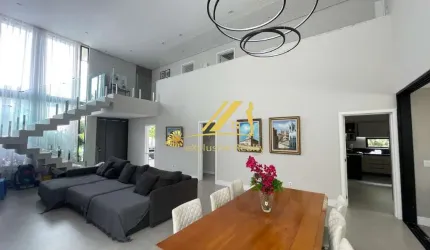 Casa moderna e sofisticada no Alphaville 1. Condomínio Itaparica. 4 suítes, piscina, área gourmet. 400m2 de área construída.