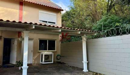 Casa em condomínio fechado com 2 quartos para alugar na Rua Treze de Maio, 600, Rio Branco, Canoas por R$ 2.000
