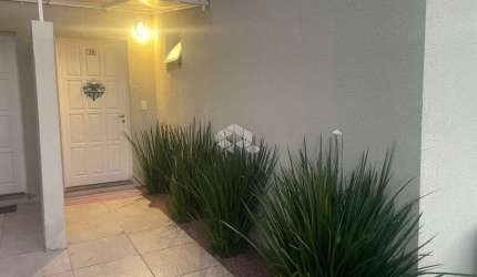 Casa em condomínio fechado com 2 quartos à venda na Beco do Soares, 515, São Lucas, Viamão por R$ 298.000