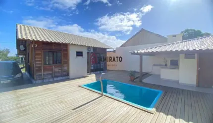 Casa à venda em Arroio do Sal com churrasqueira, piscina adulta e área de lazer